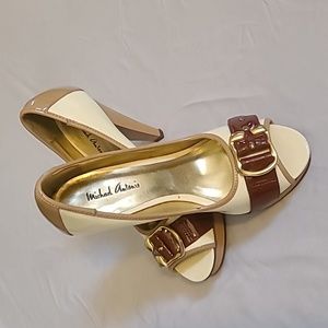 Womens 7 1/2 Michael Antonio heels high heels. Cream and brown w gold buckle